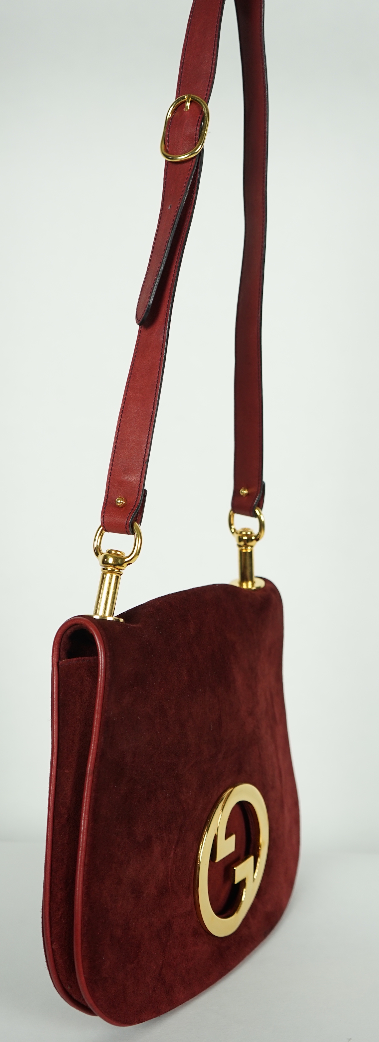 A vintage Gucci Blondie claret suede shoulder bag, width 29.5cm, max height 25cm, overall height 63cm to top buckle hole